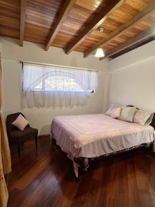 Postel nebo postele na pokoji v ubytování La Casa Ambateña