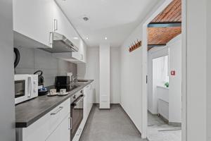 Kuchyň nebo kuchyňský kout v ubytování K22 Smart Rooms