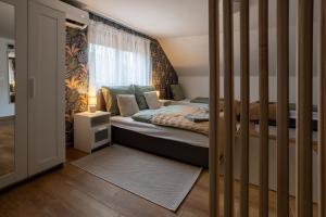 Postel nebo postele na pokoji v ubytování RP Apartmanház
