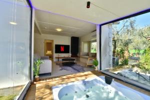 a bath tub in a room with a large window at İZNİK Lake Olive villa in İznik