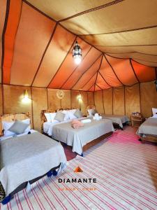 Postel nebo postele na pokoji v ubytování Diamante Luxury Camp