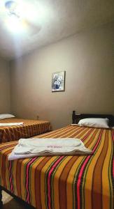 Letto o letti in una camera di Hotel Rosalila
