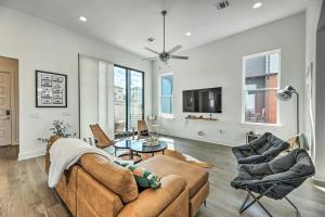 a living room with a couch and chairs and a tv at Agave Luxe Home - 8 Mi to Downtown in Austin