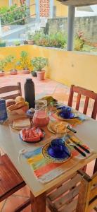 a table with plates of food on top of it at Chalés Luz do Luar in Aracati +29 photos