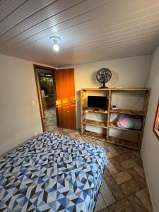 Ένα ή περισσότερα κρεβάτια σε δωμάτιο στο Casa 1 recanto toca da onça