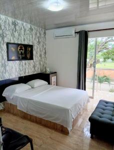 Postel nebo postele na pokoji v ubytování Hotel Palmari