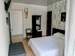 Voodi või voodid majutusasutuse Hotel Palmari toas