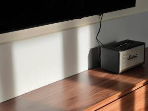 a television sitting on top of a wooden floor at Jun Home - Dalat in Da Thanh