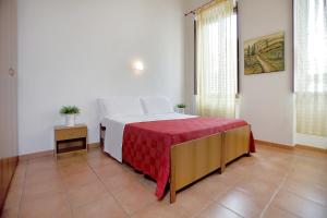 Un pat sau paturi într-o cameră la Hotel Sant' Antonio