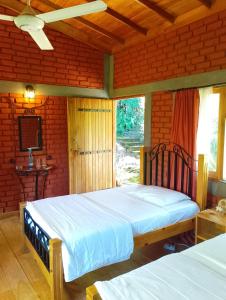 Postel nebo postele na pokoji v ubytování Tea Leaf Retreat