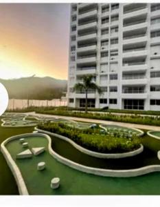 a rendering of a golf course in front of a building at Apartamento Citadela Di Sole Santa fe De Antioquia in Santa Fe de Antioquia