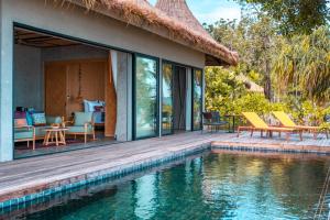 a villa with a swimming pool and a house at JATI Koh Russey in Sihanoukville +130 photos