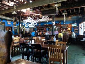a restaurant with tables and chairs and a bar at Atlanta Charming Private Room 1 in Atlanta