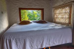 Postel nebo postele na pokoji v ubytování Sítio Vale das Aguias - Casa Alto do Vale