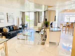 a living room with a couch and a table at OCEAN BAY VIEWS 2Bdr 2Bath BEACH CONDO PARKING in Miami Beach
