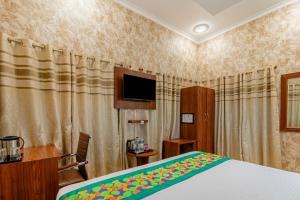 Ένα ή περισσότερα κρεβάτια σε δωμάτιο στο Treebo Una Regency - Near AIIMS Patna
