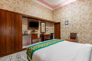 Ένα ή περισσότερα κρεβάτια σε δωμάτιο στο Treebo Una Regency - Near AIIMS Patna
