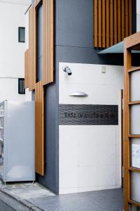 a white refrigerator on the side of a building at Base in Kyoto Hanazono in Kyoto