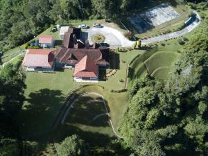 an overhead view of a house on a field at Bukit Lowick Bungalow in Tanah Rata
