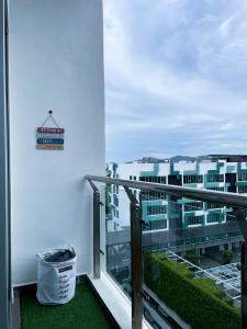 a balcony with a view of a building at Cozy Room 5min From Airport Wi-fi & Netflix At Aeropod Sovo in Kota Kinabalu