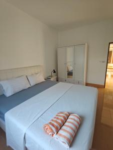 Ένα ή περισσότερα κρεβάτια σε δωμάτιο στο Rawai-Casevacanze