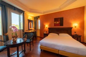 Ένα ή περισσότερα κρεβάτια σε δωμάτιο στο Hotel Teocrito