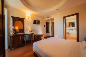 Ένα ή περισσότερα κρεβάτια σε δωμάτιο στο Hotel Teocrito