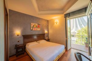 Ένα ή περισσότερα κρεβάτια σε δωμάτιο στο Hotel Teocrito