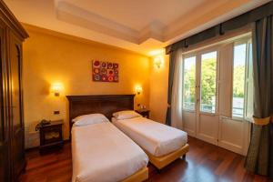Ένα ή περισσότερα κρεβάτια σε δωμάτιο στο Hotel Teocrito