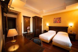Ένα ή περισσότερα κρεβάτια σε δωμάτιο στο Hotel Teocrito
