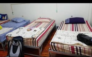 Postel nebo postele na pokoji v ubytování Yummy Hostel Backpackers