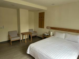 Postel nebo postele na pokoji v ubytování 慢且洄瀾文旅 Bantshiann Hualie Hotel