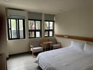 Postel nebo postele na pokoji v ubytování 慢且洄瀾文旅 Bantshiann Hualie Hotel