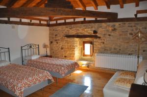 Llit o llits en una habitació de Don Baldomero Hotel Rural