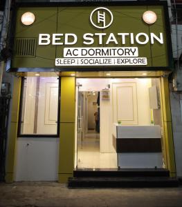a sign for a bed station as a store at Bed Station AC Dormitory in Varanasi