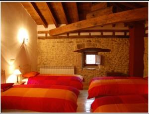 Llit o llits en una habitació de Don Baldomero Hotel Rural