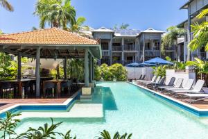 an image of a swimming pool at a resort at Honeymoon Spa Suite 53 in Port Douglas