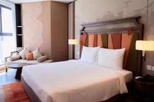 Ein Bett oder Betten in einem Zimmer der Unterkunft The Apec Mandala Ocean View Mui Ne - Condotel