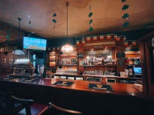 a bar in a restaurant with a lot of alcohol at Country Village Hotel in Cagayan de Oro