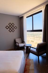 Ein Bett oder Betten in einem Zimmer der Unterkunft The Apec Mandala Ocean View Mui Ne - Condotel