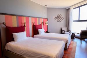 Ein Bett oder Betten in einem Zimmer der Unterkunft The Apec Mandala Ocean View Mui Ne - Condotel