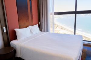 Ein Bett oder Betten in einem Zimmer der Unterkunft The Apec Mandala Ocean View Mui Ne - Condotel