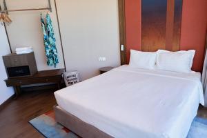 Ein Bett oder Betten in einem Zimmer der Unterkunft The Apec Mandala Ocean View Mui Ne - Condotel