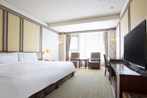 Et tv og/eller underholdning på Evergreen Resort Hotel - Jiaosi