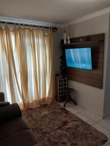 Et tv og/eller underholdning på apartamento confortável aconchegante