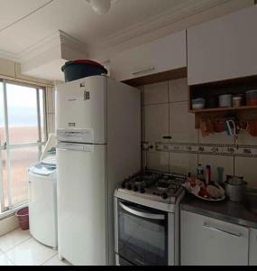 Køkken eller tekøkken på apartamento confortável aconchegante