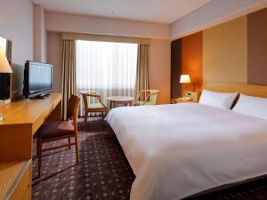 Postel nebo postele na pokoji v ubytování Miyako Hotel Kyoto Hachijo