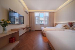 Jianshui Yunshui Inn客房内的一张或多张床位