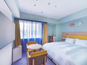 Postel nebo postele na pokoji v ubytování Miyako Hotel Kyoto Hachijo