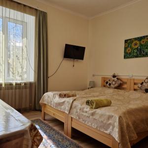 Postel nebo postele na pokoji v ubytování Sunhome Stepanavan Guest House